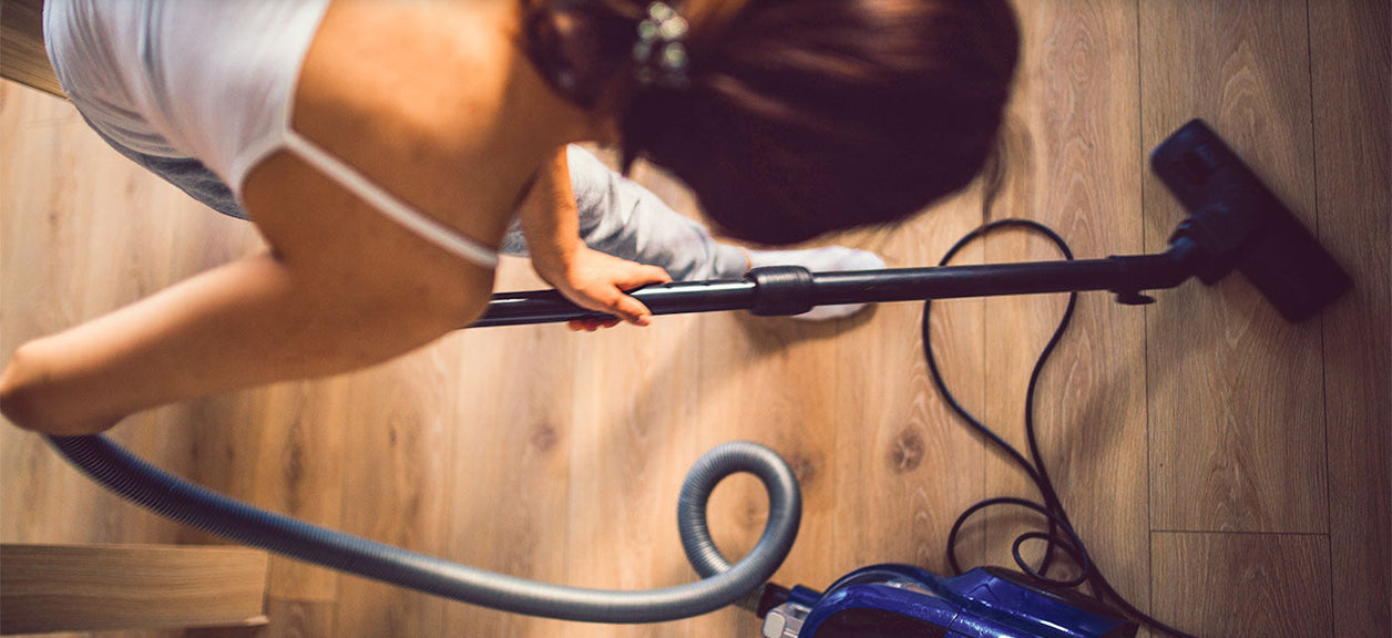 woman vacuuming house