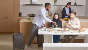 A group learning to boost mood naturally with an AirMega 400s.
