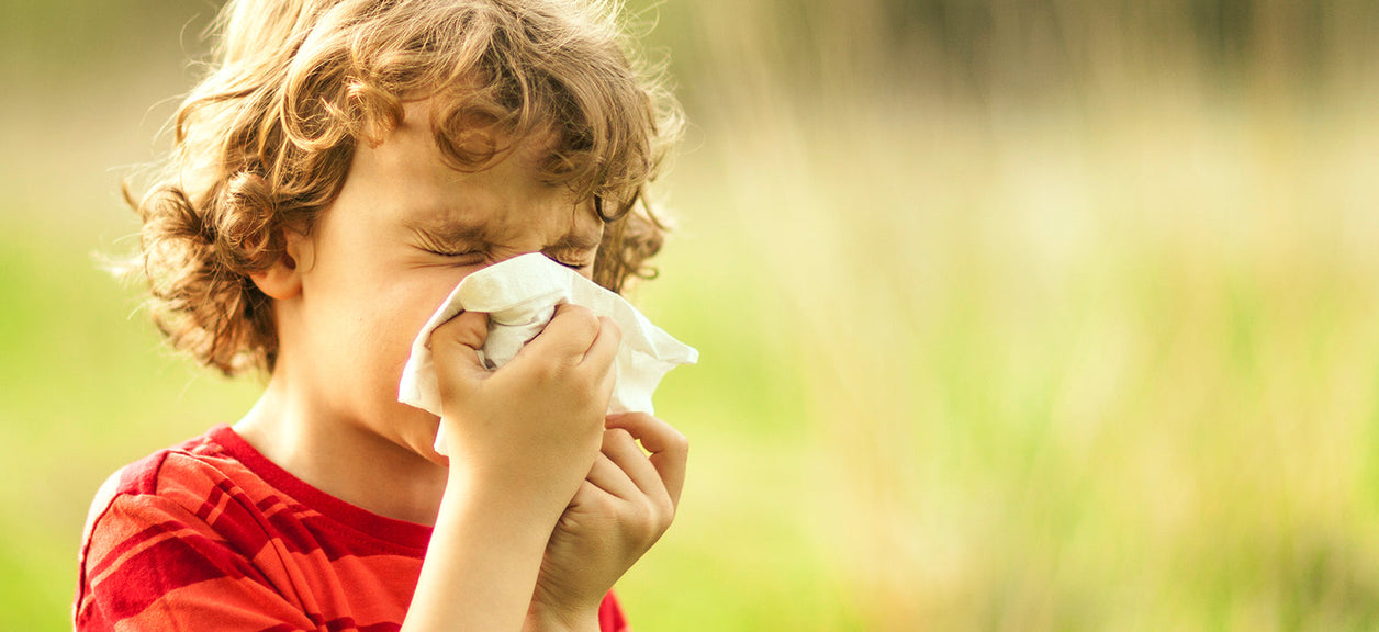 child blowing their nose