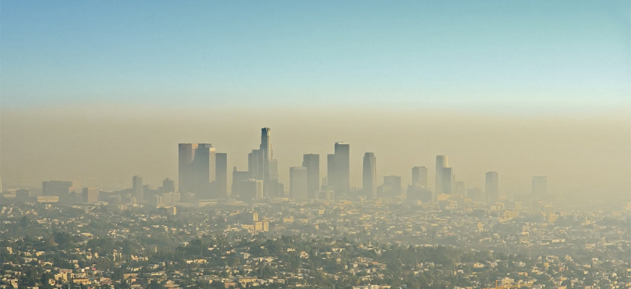 city in behind heavy smog