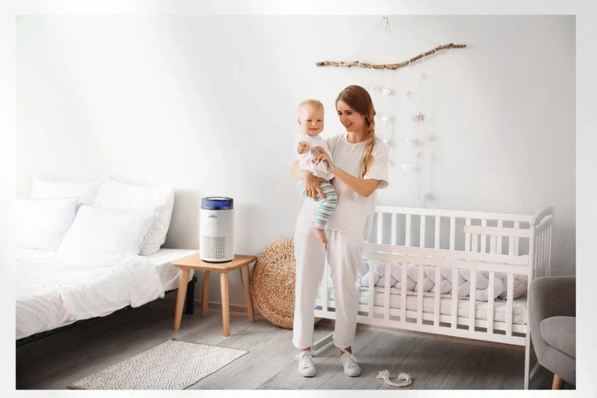 A mother and baby in a nursery with an Airmega 100.