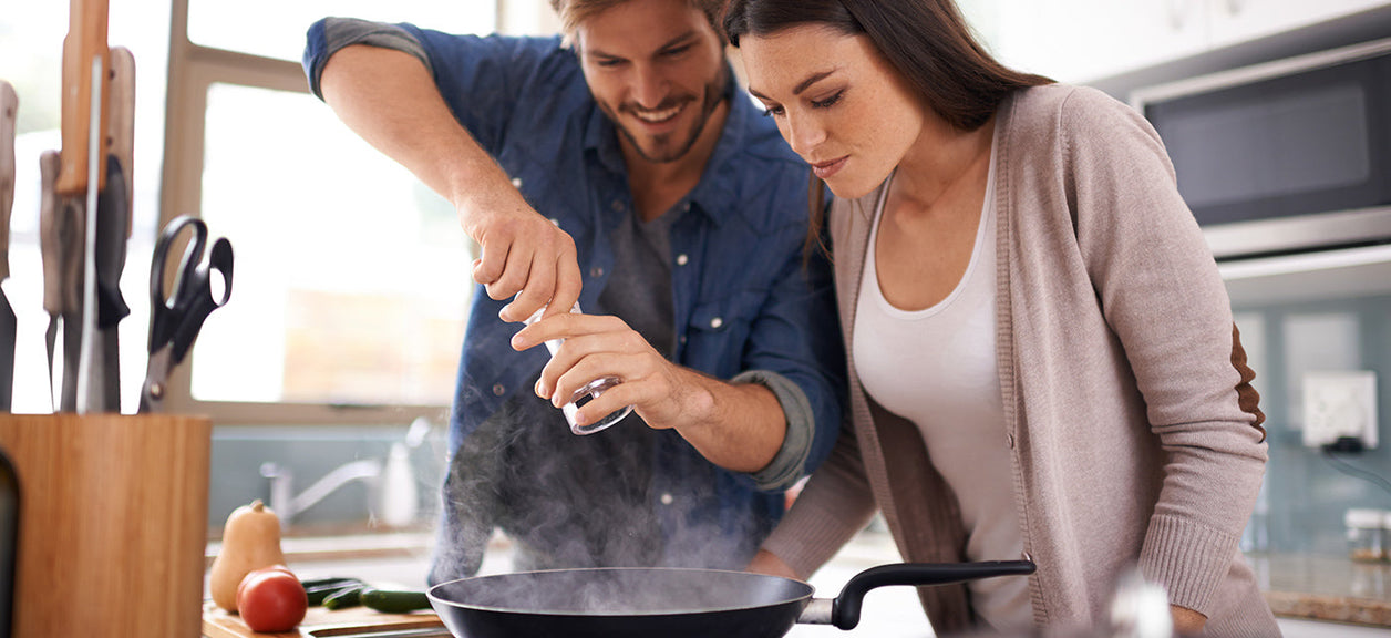 couple cooking in kitchen